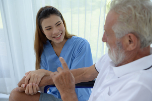 a caregiver homecare in lancaster talking to elderly patient with dementia