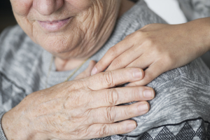 closeup-support-hands-as-grand-father-is-diagnosed-under-a-specific-types-of-dementia