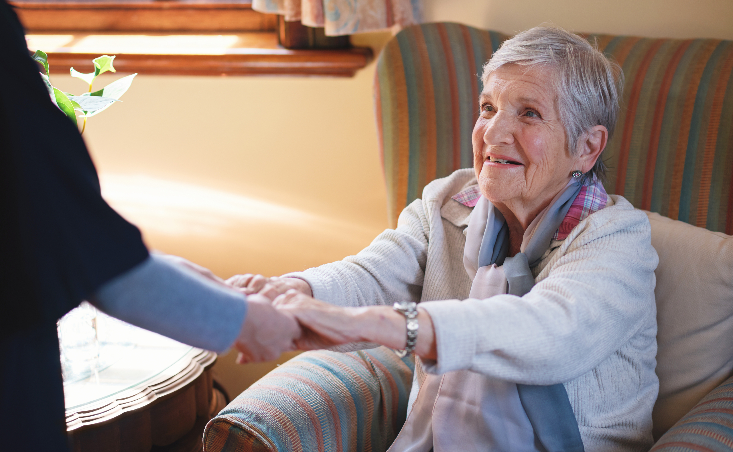 caregiver helping senior woman at home supported living vs domiciliary care concept caregiver helping senior woman at home supported living vs domiciliary care concept