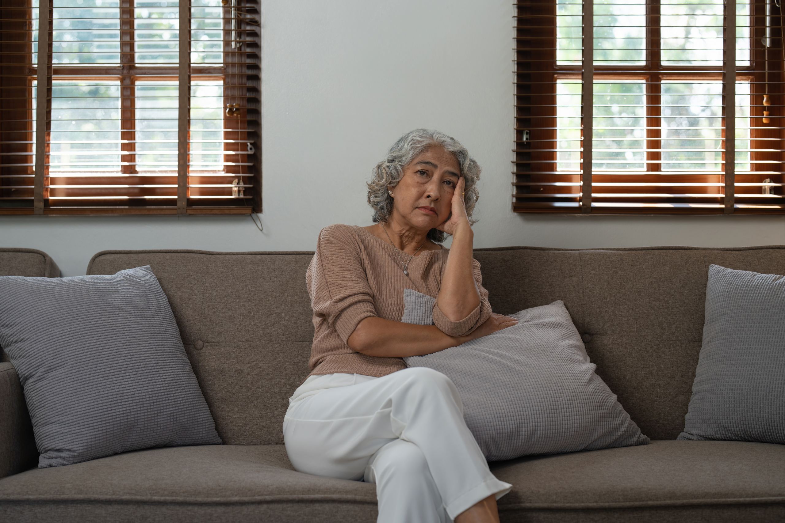 signs your loved one needs extra support at home - adult child checking on elderly parent