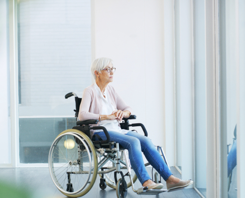 A care professional supporting an elderly woman using the dementia training standards framework to promote dignity and emotional wellbeing at home