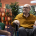 Care provider discussing specialist dementia training with an elderly man in a wheelchair and his supportive wife