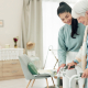 A carer supporting an older person while walking, part of dementia and falls prevention
