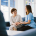 Trained carer using dementia communication training techniques to connect gently with an elderly woman at home