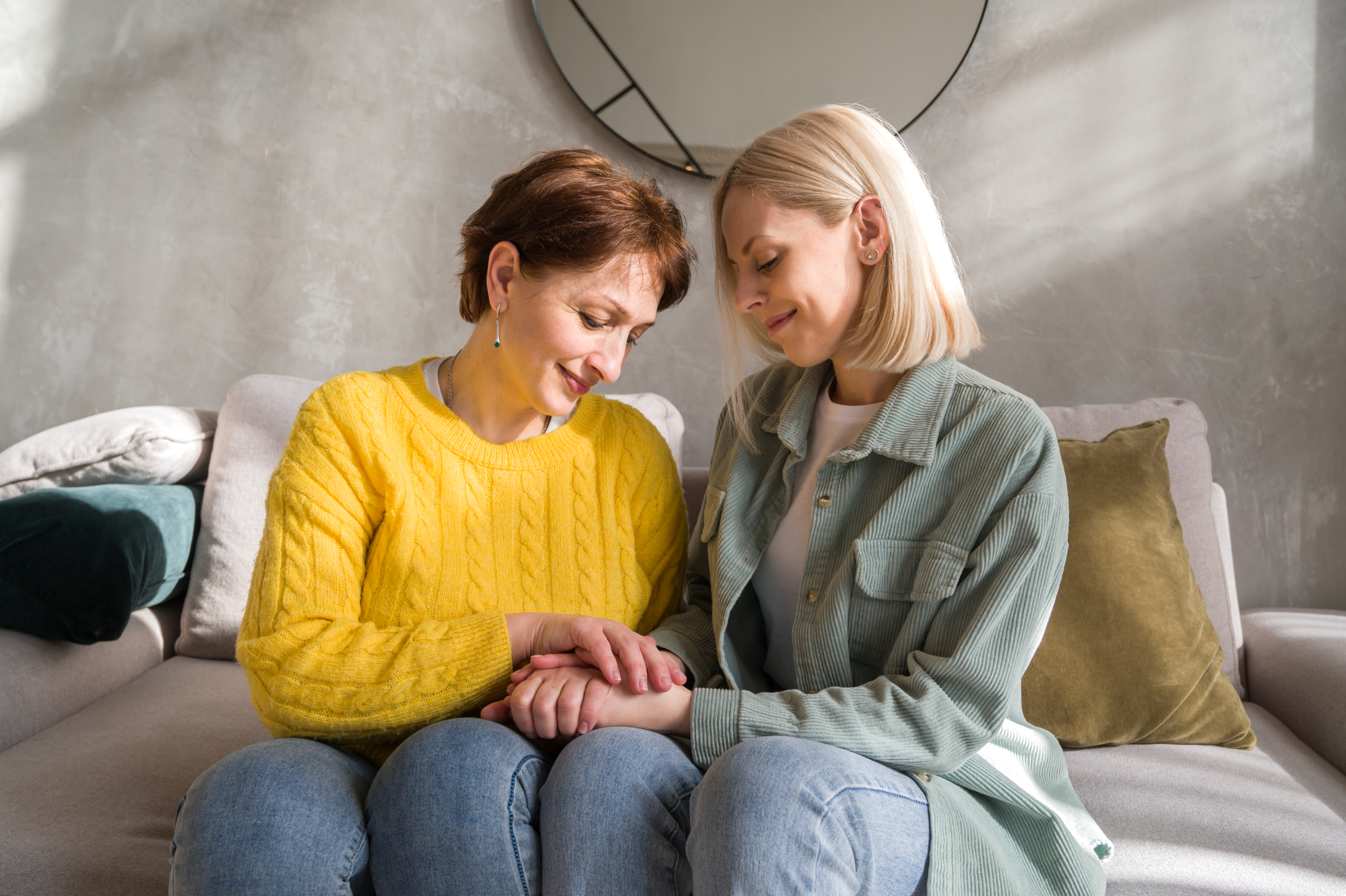 Specialist carer supporting an elderly woman at home, demonstrating the value of dementia specialist training