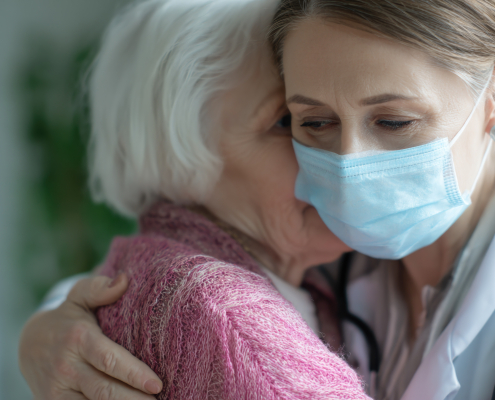 A specialist home carer providing support to an elderly individual, demonstrating the clinical standard of dementia training for nurses in a home care setting.