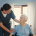 A professional carer supporting an elderly woman at home, illustrating home care for the elderly in Lancashire