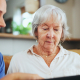 A carer and elderly woman sharing a conversation during a private companion visit at home in Lancashire, private companion for elderly near me.